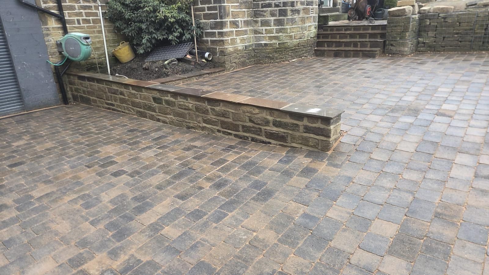 Completed natural stone patio with matching garden steps